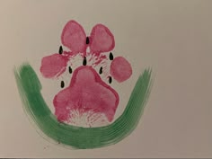 a drawing of a pink dog paw with drops of water on it's paws