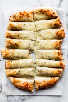 the pizza is cut into eight pieces and ready to be eaten on the counter top