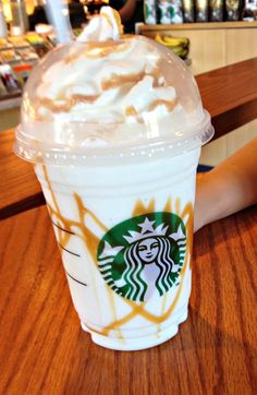 a starbucks drink with whipped cream on top