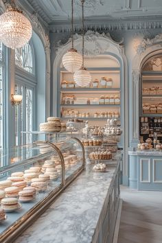 a bakery filled with lots of different types of cakes and cupcakes on display