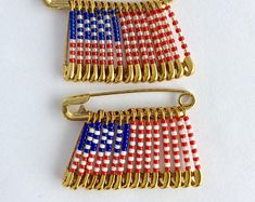 two american flag pin brooches on white background