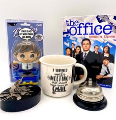 the office season three coffee mug with keychain and bobble head next to it