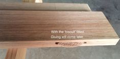 a piece of wood with the words, with the biscuit fired gluing will come later