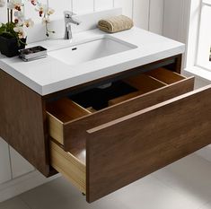 a bathroom sink with drawers underneath it