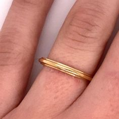 Vintage 1940's 14k yellow gold plain ridge band with Jabel trademark. The band is a size 7. The width of the band is 2.3mm. The height of the ring off the finger is 1.5mm. Heirloom 14k Gold Open Band, Classic Rings With Decorative Open Band, Heirloom Yellow Gold Thick Band, Heirloom Thick Band In Yellow Gold, Classic Engraved Ring With Polished Edges, Heirloom Gold Midi Rings With Round Band, Yellow Gold Rings With Decorative Thick Band, Classic Engraved Stackable Ring, Classic Gold Midi Rings Stamped 14k