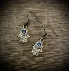 Gold and jeweled Hamsa hand earrings! Metal Jeweled Earrings As Gift, Jeweled Metal Earrings As Gift, Metal Jeweled Earrings For Gift, Jeweled Earrings As Gift, 17 Feb, Hand Earrings, Hamsa Hand, Jewelry Earrings Dangle, Dangle Drop Earrings