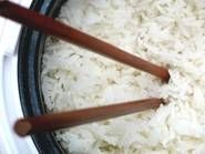 two wooden sticks sticking out of the side of a white bowl