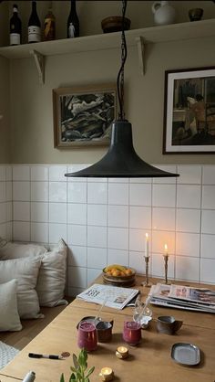 a dining room table with candles on it