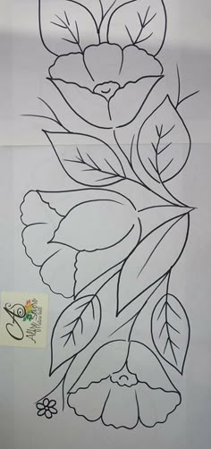 a drawing of flowers and leaves on a sheet of paper