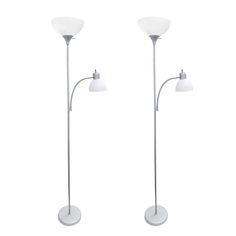 two white floor lamps with one light on each side and the other off to the side