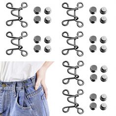 several pairs of metal hooks attached to the side of a pair of jeans with buttons on them