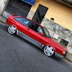 a red car parked in front of a building