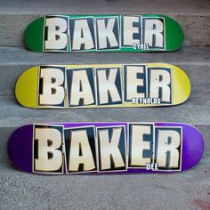 two skateboards with the words baker and baker printed on them sitting on concrete steps