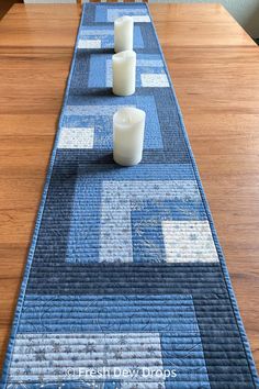 a table runner with candles on top of it