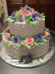 a three tiered cake with flowers on it