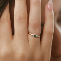 "Emerald Ring / 14k Solid Gold with Marquise Emerald Ring in Halo Setting with Round Pave Diamonds by Ferkos Fine Jewelry / May Birthstone Item Details  * Made to Order * Gold Kt: 14K (also available in 18K) * Available Gold Color: Rose Gold, Yellow Gold, White Gold * Round Diamond: 12 pcs 1.0 MM * Marquise Emerald: 1 pc 4 X 2 MM * Diamond Carat Weight: 0.07 ctw * Emerald Carat Weight: 0.10 ctw * Diamond Color-Clarity: G Color SI Clarity If you have any additional questions about this ring, just hit the \"Message Ferko\" button and we will get back to you within a few hours. ▶ See more of our Emerald Jewelry - https://etsy.me/3QCyZBQ ▶ See our storefront here - http://etsy.me/2lUcVnH  ▶ All store sections here * Diamond Rings - http://etsy.me/2lwKUl8 * Diamond Earrings - http://etsy.me/2ly Elegant Emerald Three-stone Birthstone Ring, Fine Jewelry With Gemstone Accents For Promise, Promise Jewelry With Emerald Birthstone, Emerald Cut Gemstone Jewelry For May Birthstone, Emerald Birthstone Jewelry For Promise, May Birthstone Jewelry With Emerald Cut Gemstone Accents, May Birthstone Jewelry With Gemstone Accents, Round Cut, 14k Gold Three Stone Round Band Jewelry, Diamond Rings With Gemstone Accents For Promise