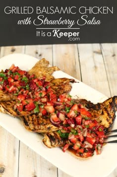 grilled balsamic chicken with strawberry salsa on a white plate