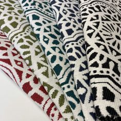 four pieces of fabric with different patterns on them