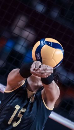 a volleyball player about to hit the ball