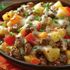 a close up of a plate of food with meat and vegetables in it on a table