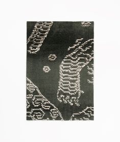 a black and white rug with an intricate design