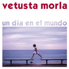 a child is walking on a bench by the ocean with words in spanish and english