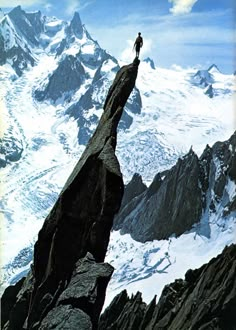 a man standing on top of a mountain