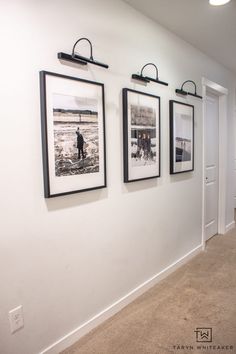 three black and white pictures hanging on the wall