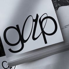 an open book with the word gap written in black ink on it next to a pair of scissors