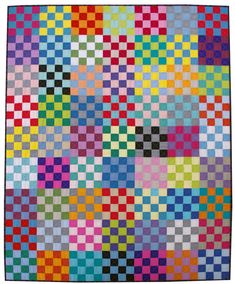 a multicolored quilt with squares on it