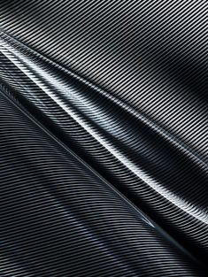 an abstract image of black and white lines on a sheet of metal foil or fabric