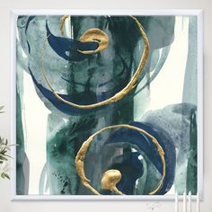 an abstract painting with gold and blue colors on white paper, featuring two circular shapes