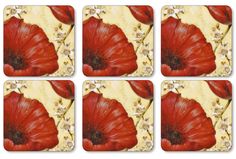 four square coasters with red flowers on them