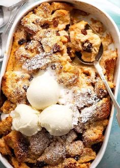 a casserole dish with ice cream in it and spoons on the side