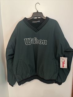 a green jacket with the word wilson on it