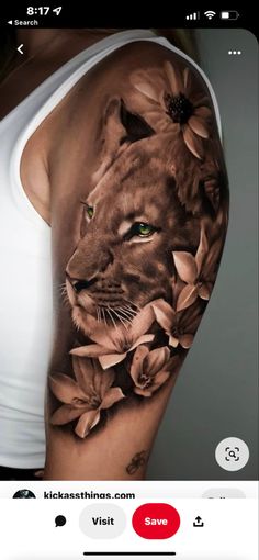 an image of a woman's arm with flowers on it and a lion in the middle