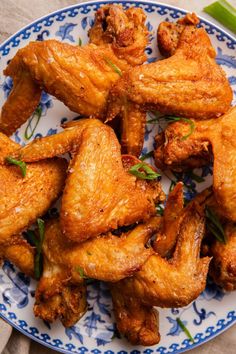 chicken wings on a blue and white plate