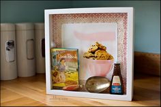 there is a box with some food in it on the table next to other items