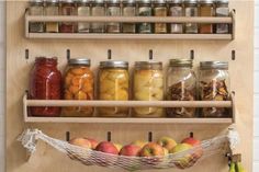 an assortment of fruits and vegetables in jars on shelves