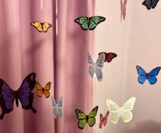 the curtains are decorated with colorful butterflies