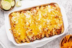 a casserole dish with cheese and tortilla chips