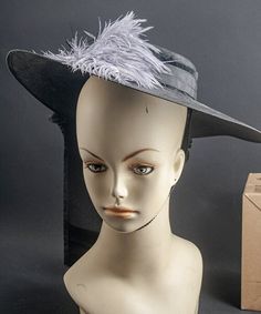 This started its life back in the 30's or 40s. It's a sleek, slim, woven hat made to wear on the very top of your head, that's why it has a chin strap.  Ive added a spray of feathers, a large bow, and a couple of jewels to liven it up a bit. A great addition to a costume, or just to wear when you feel a bit fancy. Please ask all questions before purchase.  Please consider that shipping and handling, and research are included in the price. Vintage items are most often not pristine. I try to call Woven Hat, Ostrich Feather, Large Bow, Ostrich Feathers, Hat Making, Wide Brimmed, Feathers, Vintage Items, Spray