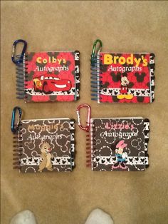 three children's notebooks with mickey mouse characters on them