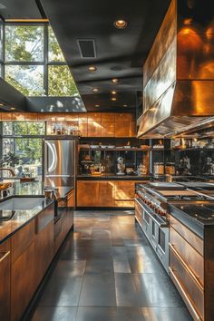 a large kitchen with lots of counter space and stainless steel appliances on the walls, along with windows