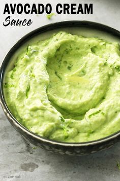 avocado cream in a bowl with the text above it