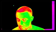 a man with red hair and green eyes is shown in an image that appears to be infrared