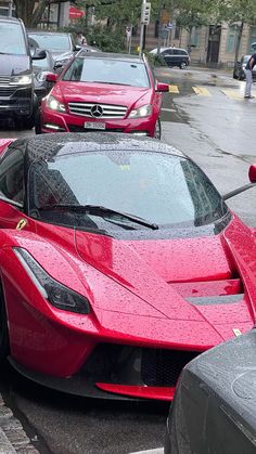 a red sports car is parked on the street