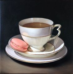 a painting of a cup of coffee and macaroons