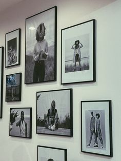 black and white photographs are hanging on the wall