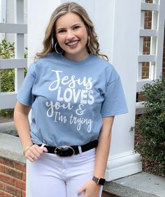 This Jesus Loves You And I'm Trying Shirt is a cute way to display your faith and sense of humor at the same time! This shirt is made of 100% Cotton. This tee runs true to size and has a unisex fit.

*6.0 oz. pre-shrunk 100% cotton (Dark Heather, Heather Cardinal, Heather Indigo, Heather Navy, Heather Sapphire, Safety Green, Safety Orange and Safety Pink are 50/50 cotton/polyester.)*Double-needle stitched neckline, bottom hem and sleeves Jesus Loves You, Sense Of Humor, Carolina Blue, Im Trying, Jesus Loves, Sense, Sapphire, Jesus, Love You